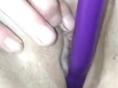 wife masturbates and puts a vibrator into her shaved pussy