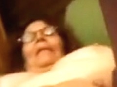 Horny old lady in glasses just loves masturbating on camera