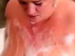 My juggy blonde lover plays with her huge tits in the bathroom