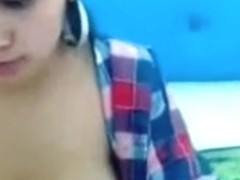 A hot girl showing her milk on webcam.