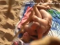 Hidden cam video with a mature amateur couple banging on a beach