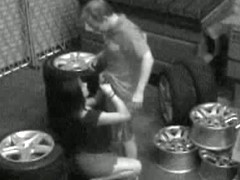 Guy packs babe in mouth and pussy on candid camera in the garage