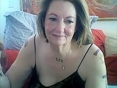 Mature tattooed lady sucks fat cock