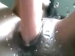 Squirting girl gets soaking wet in her own cum