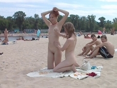 Nasty juvenile nudists play with every other in sand
