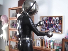 Girl In Latex And Metal And Chastity Belt With Vibrator