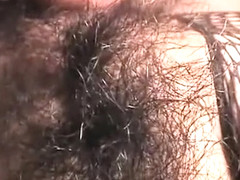 Japanese cutie in fishnets has a cock and a sex toy pleasing her pussy