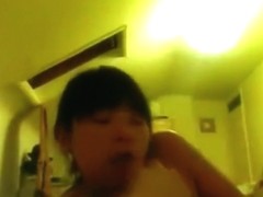 Asian girl sucks her white bf's cock on the bed and swallows