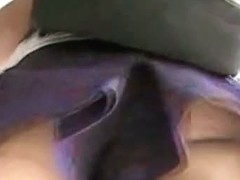 Attractive and perfect female ass in a purple skirt voyeur video