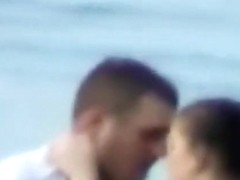 Voyeur tapes a horny couple having sex in the sea